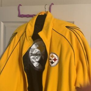 Never worn jacket. 2 jackets in one.  Black side is nylon. Yellow side is felt?